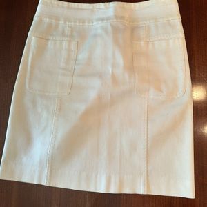 Tory Burch ivory fine-ribbed light stretch mini skirt with 2 front pockets.